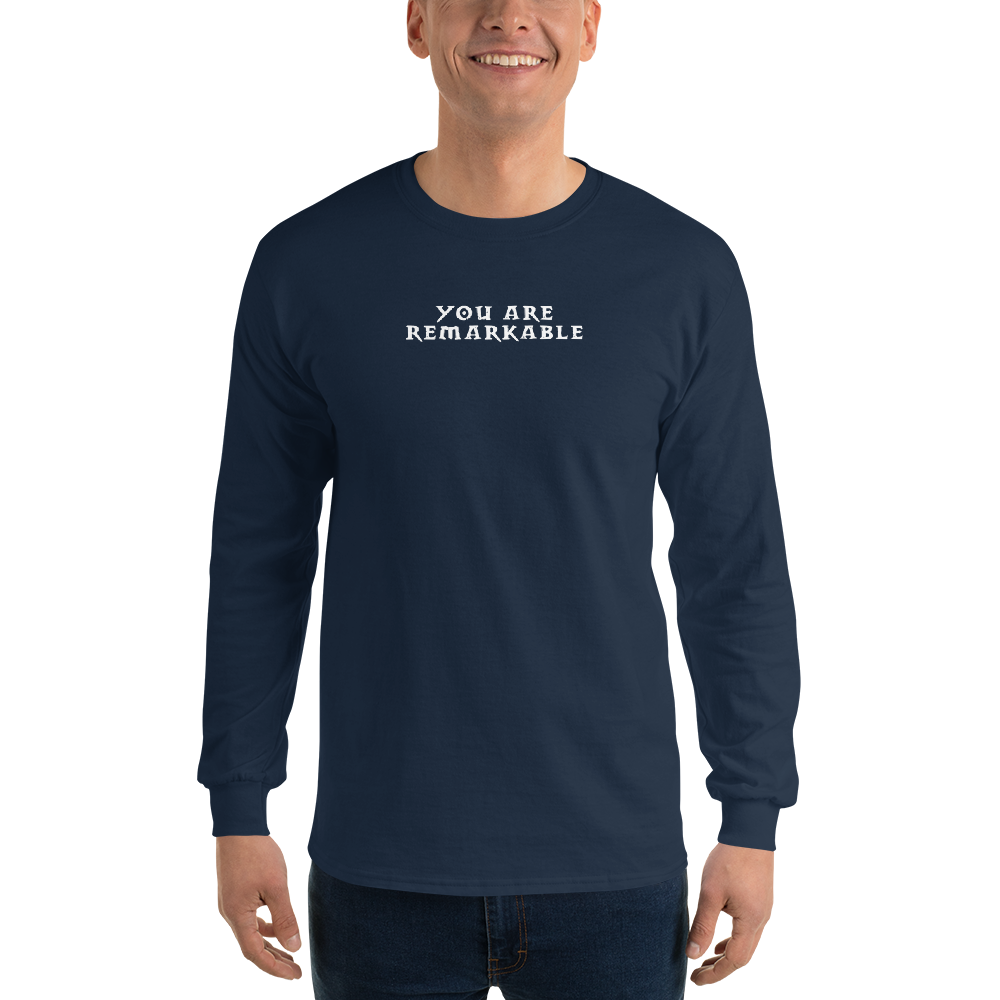 "You are remarkable" printed on a navy men's long sleeve shirt worn by a male