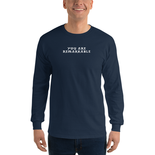 "You are remarkable" printed on a navy men's long sleeve shirt worn by a male