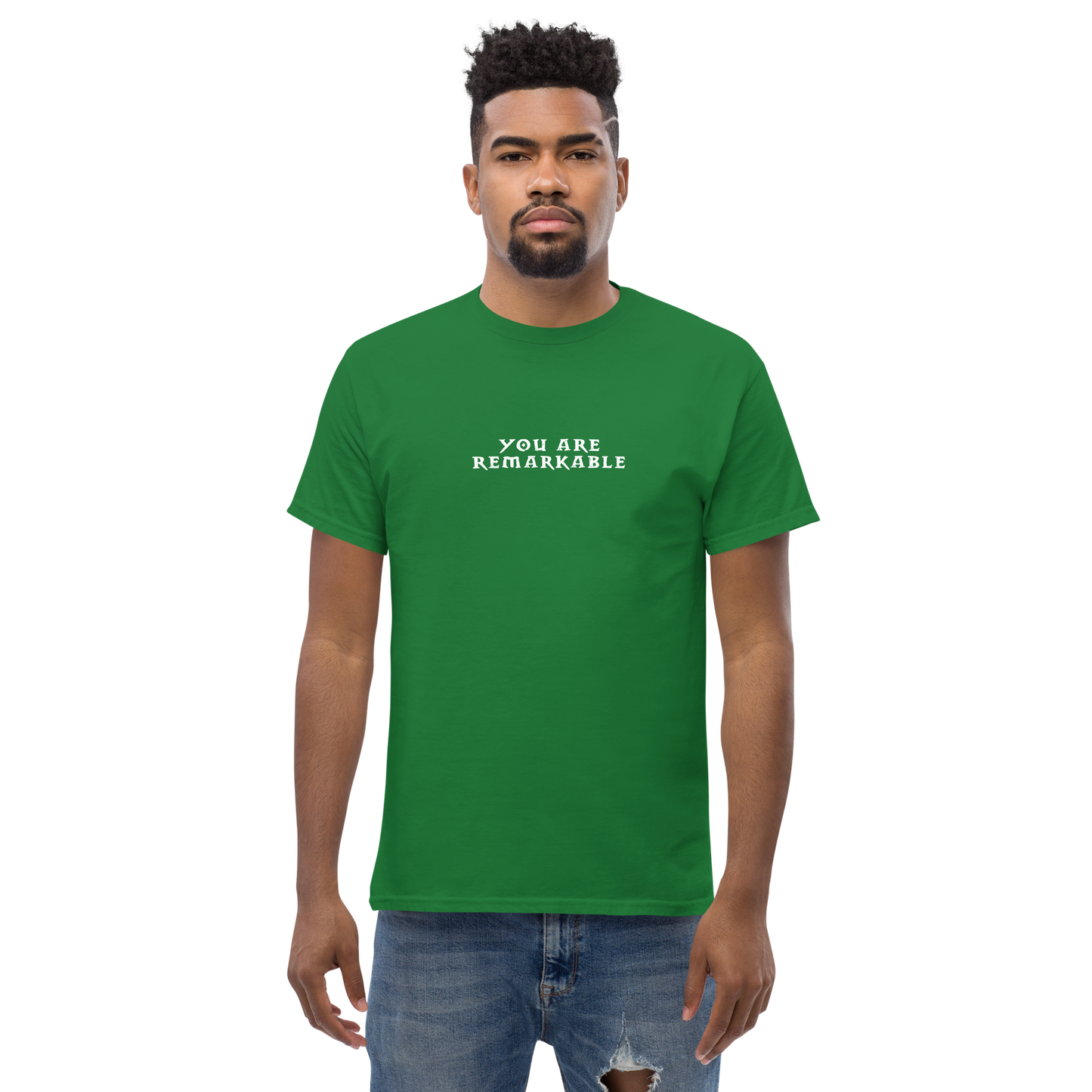 "You are remarkable" printed on a turf green unisex classic tee worn by a male