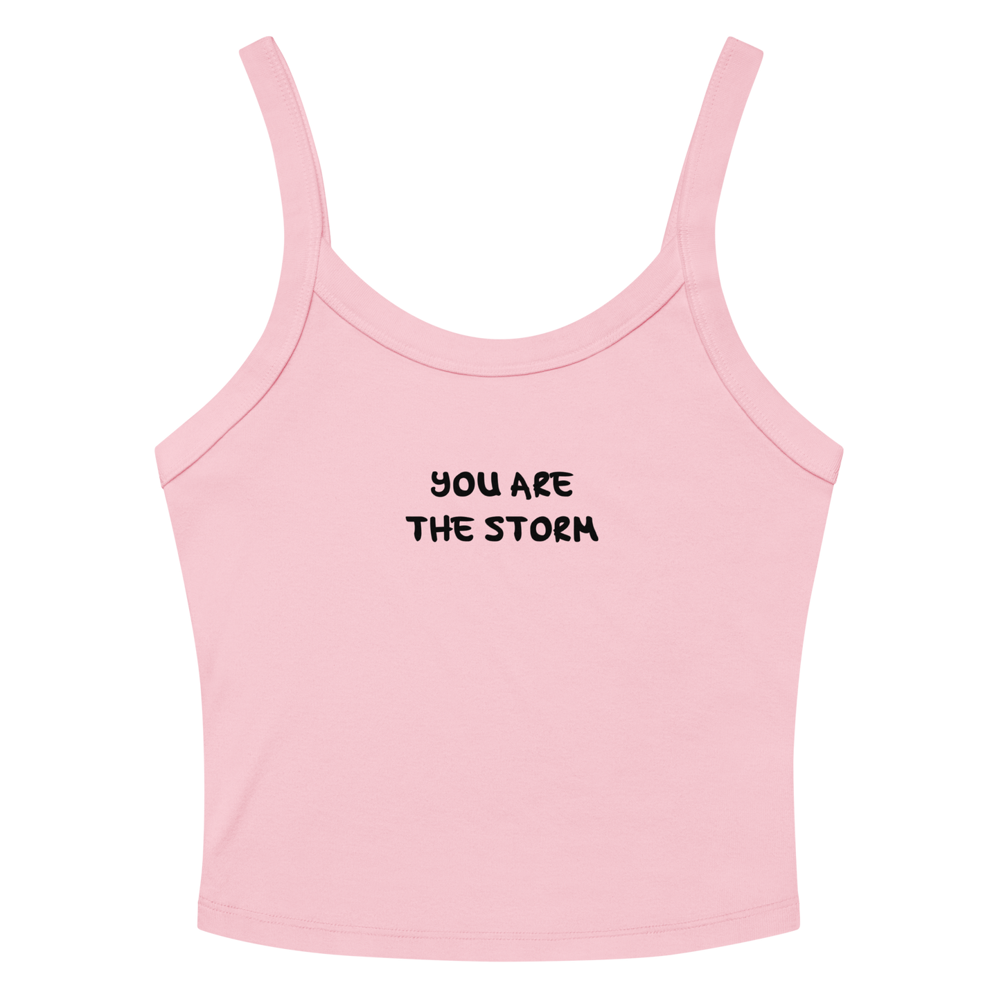 "You are the storm" printed on a solid pink blend women's micro-rib tanktop laying on a flat surface amongst sunglasses and shorts