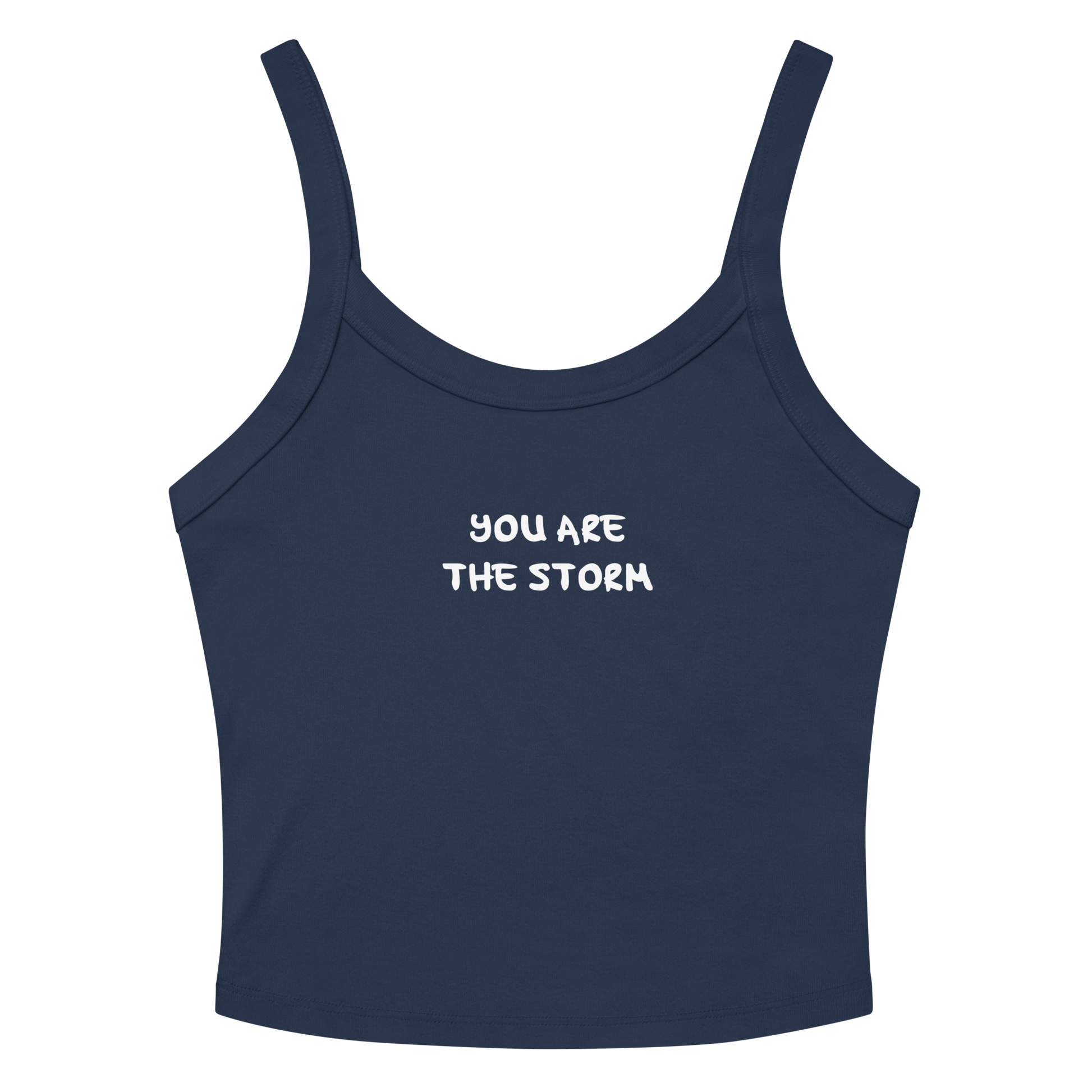"You are the storm" printed on a solid navy blend women's micro-rib tanktop laying on a flat surface amongst sunglasses and shorts