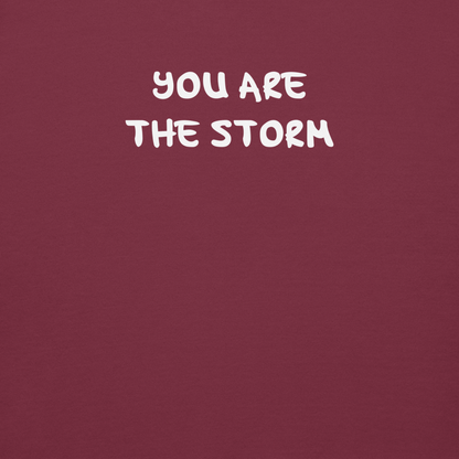 "You are the storm" printed on a maroon background