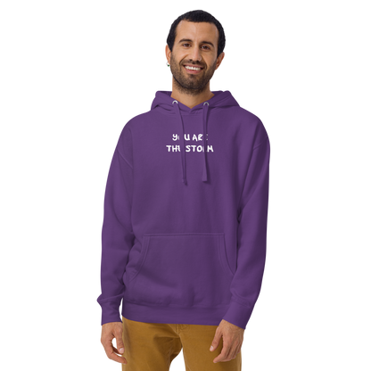 "You are the storm" printed on a purple warn by a male