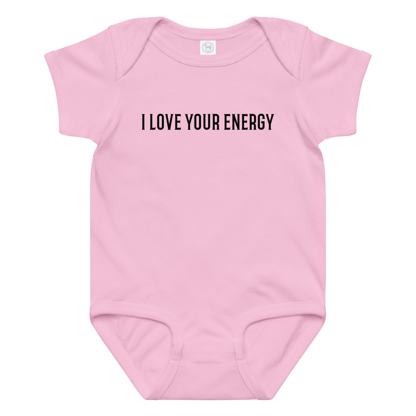 "I love your energy" printed on a pink baby jersey bodysuit laying on a flat surface amongst other clothes