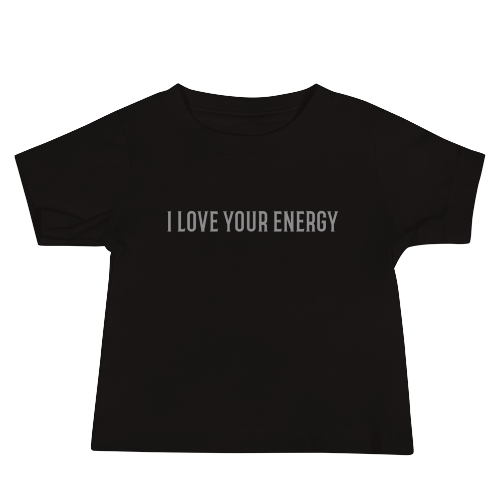 "I love your energy" printed on a black baby jersey short sleeve tee laying on a flat surface
