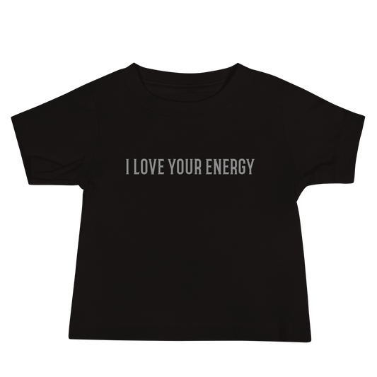 "I love your energy" printed on a black baby jersey short sleeve tee laying on a flat surface
