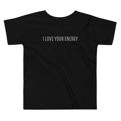 "I love your energy" printed on a black toddler short sleeve tee laying on a flat surface
