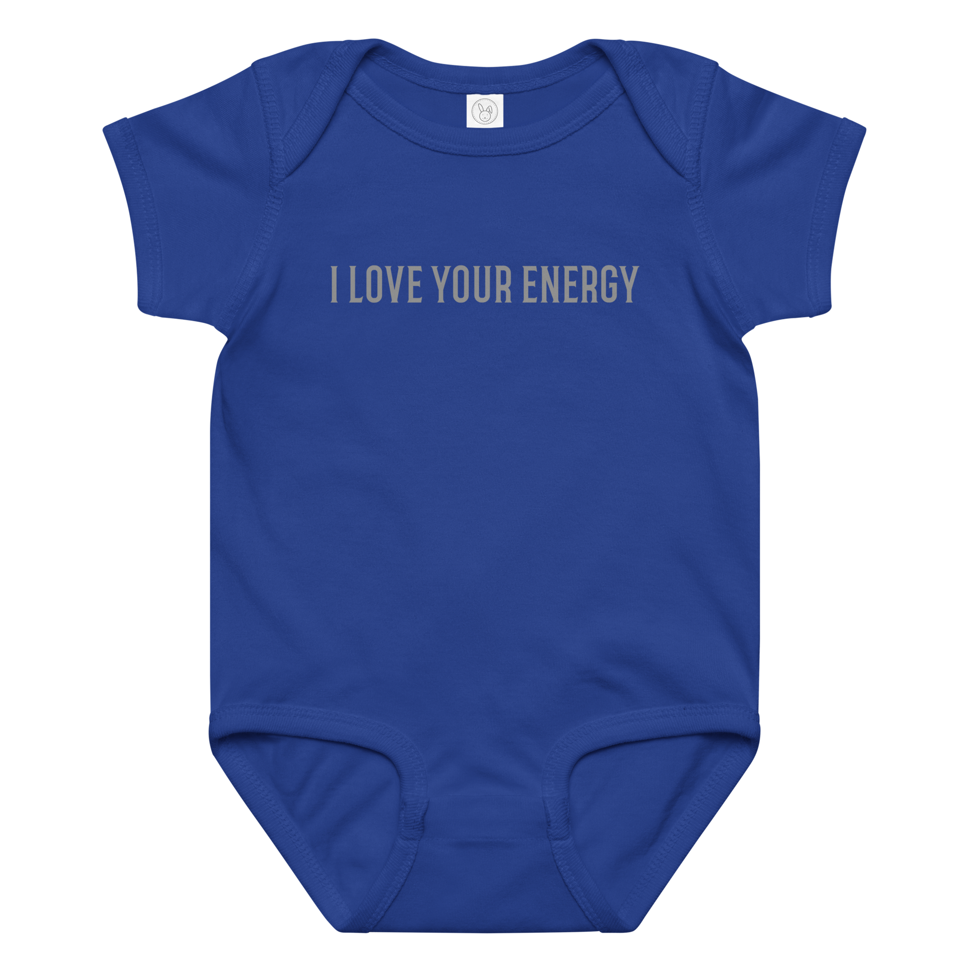 "I love your energy" printed on a royal baby jersey bodysuit laying on a flat surface amongst other clothes
