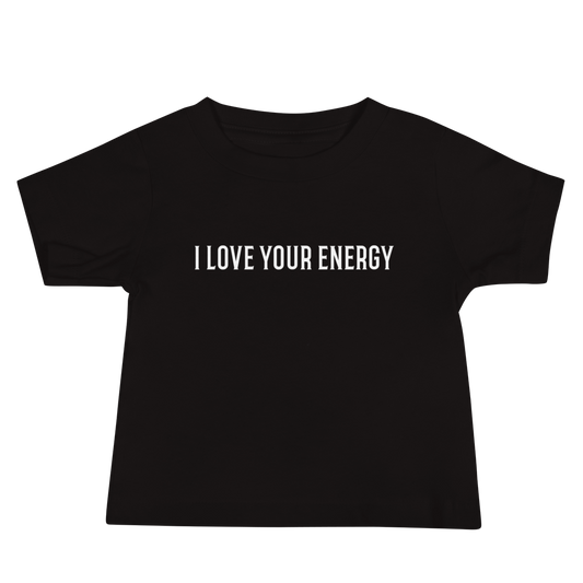"I love your energy" printed on a black baby jersey short sleeve tee laying on a flat surface