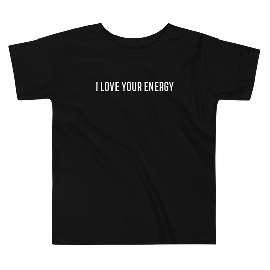 "I love your energy" printed on a black toddler short sleeve tee laying on a flat surface