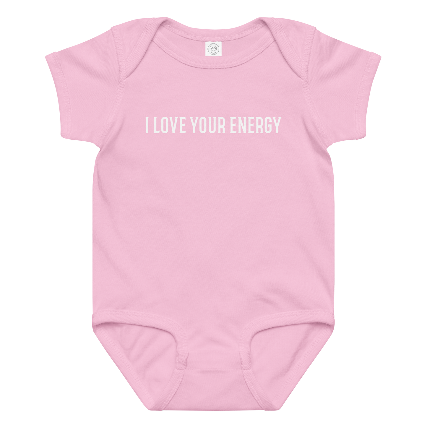 "I love your energy" printed on a pink baby jersey bodysuit laying on a flat surface amongst other clothes