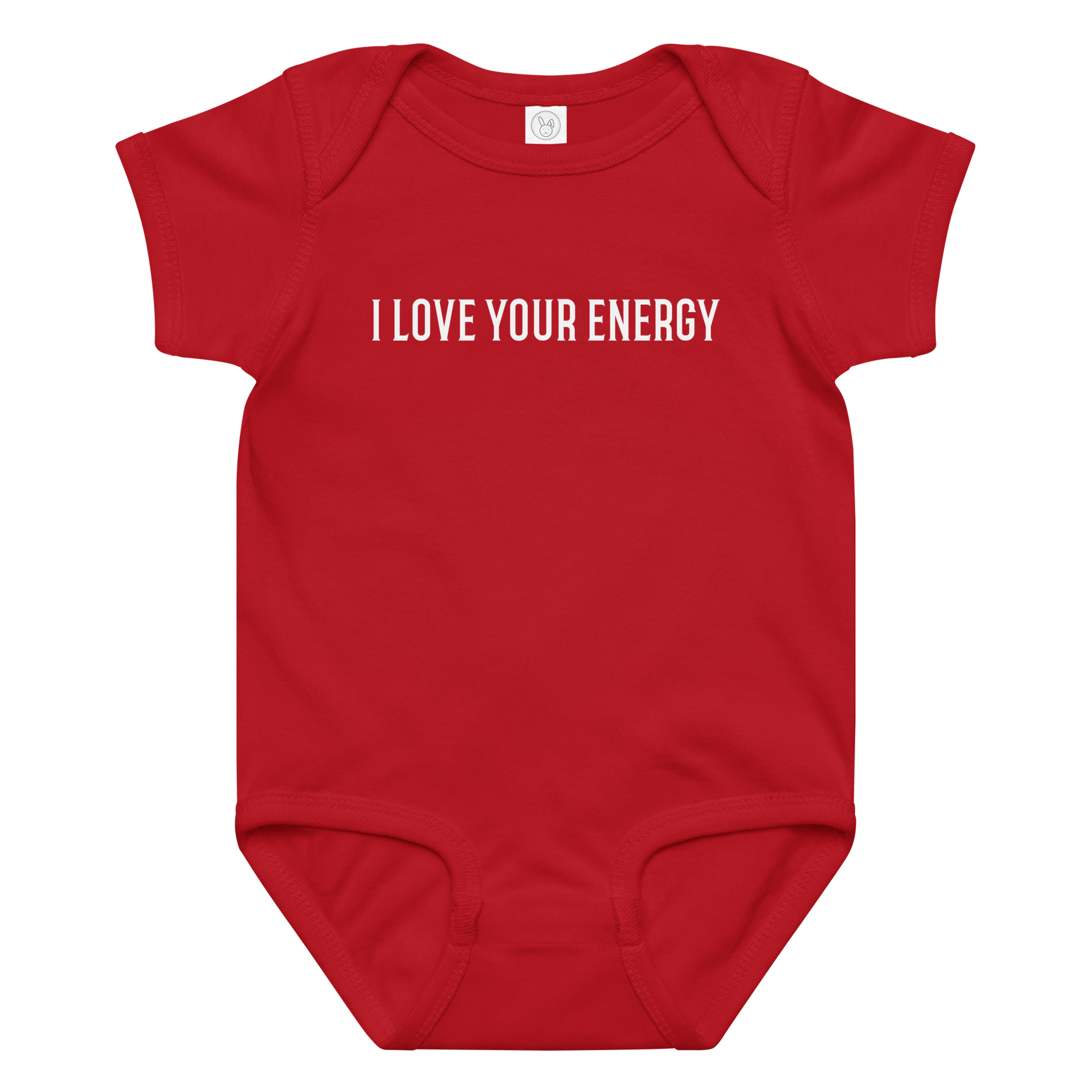 "I love your energy" printed on a red baby jersey bodysuit laying on a flat surface amongst other clothes