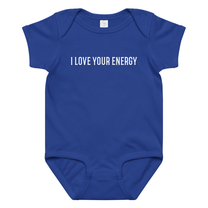 "I love your energy" printed on a royal baby jersey bodysuit laying on a flat surface amongst other clothes